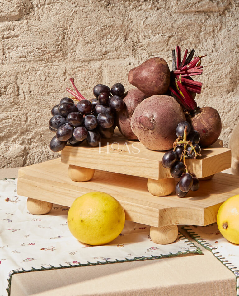 DAWA, sungkai wood serving board on raised legs, Haas Design