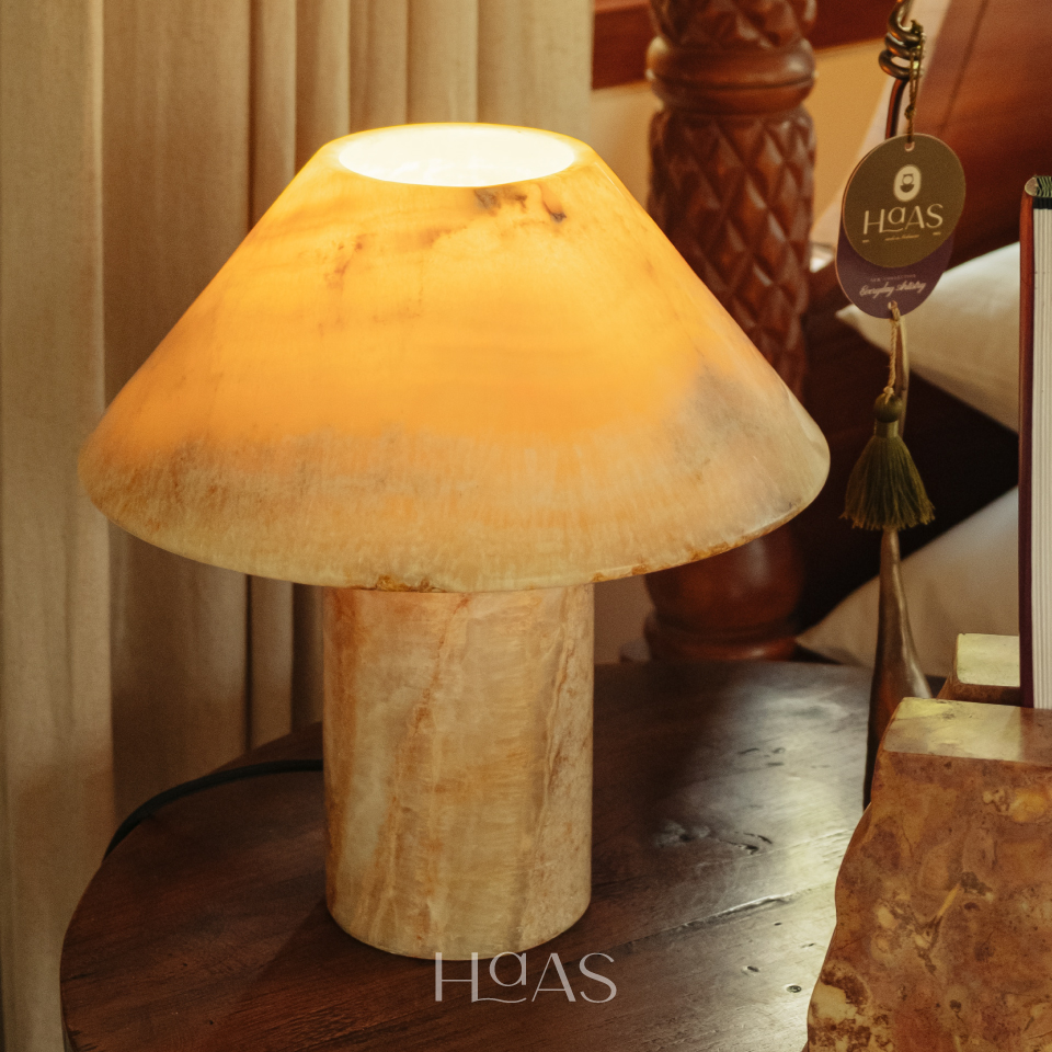 BHUMI onyx marble lamp lit, light passing through the onyx marble shade