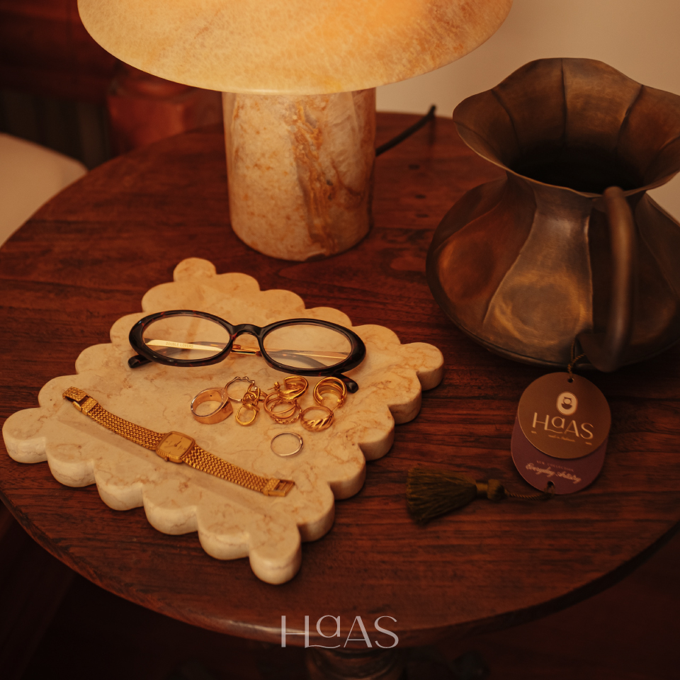 OMBAK natural marble tray on a round side table beside a table lamp
