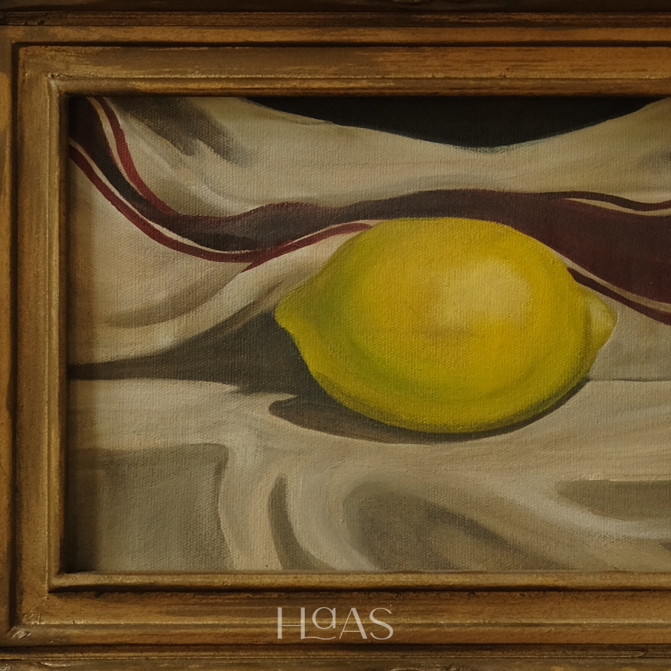 Detail of Citron No. 9, an acrylic still life of a single yellow lemon in its frame