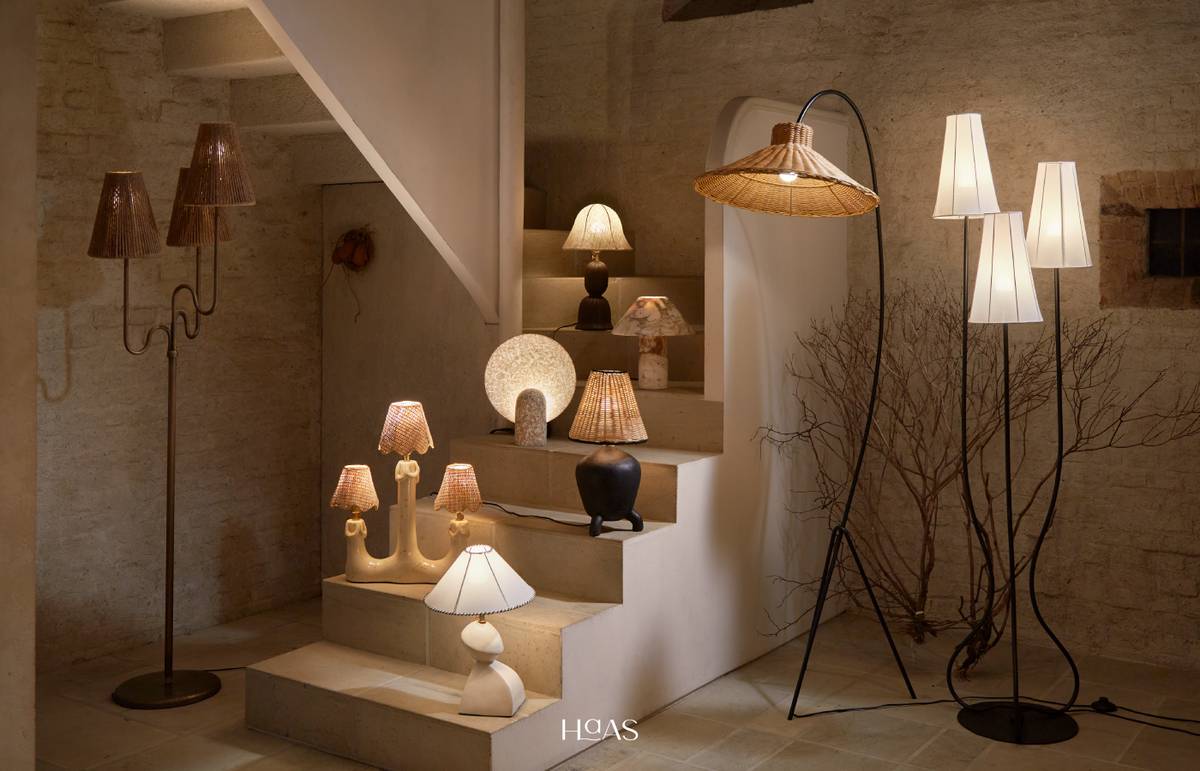 Haas handmade lamps in rattan, clay and marble arranged on stone steps